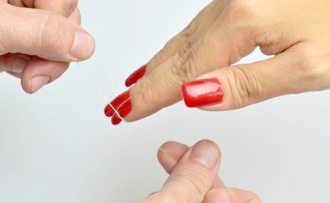 Remove The Acrylic Nails With Dental Floss