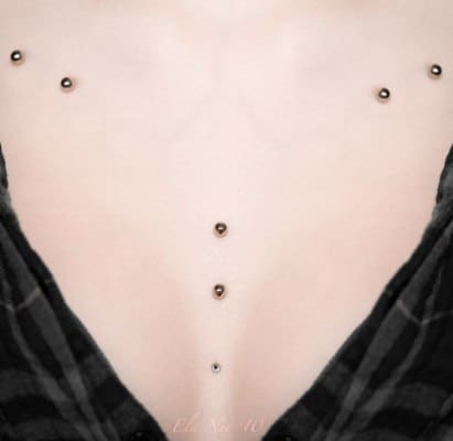 Micodermal piercing on chest